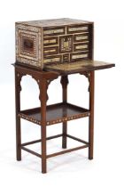 A 19th century Anglo-Indian or Portuguese teak and ivory mounted collector's cabinet, the fall-front