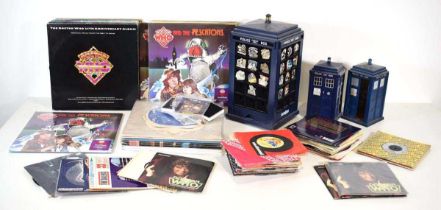 A collection of Dr Who and related LPs, singles, Police Boxes and badges (Qty)