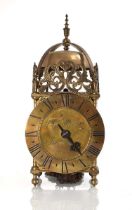 A lantern clock striking on a bell, the dial signed 'Thos (Thomas) Moore Ipswich', within a