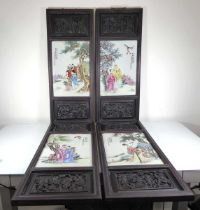 A set of four Chinese Export porcelain plaques, each depicting figures under pine trees in a