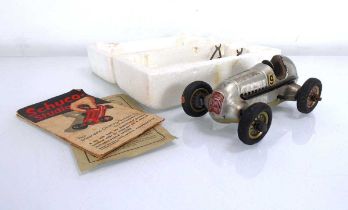 A Schuco Studio clockwork racing car, l. 14 cm
