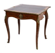 A 19th century walnut, kingwood and marquetry folding table, the interior with a tooled leather