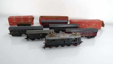 A Marklin OO gauge 'crocodile' loco, five coaches and a wagon, partial boxes (7)