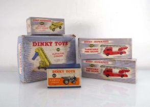 A group of Dinky commercial models including 562 dumper truck, 956 turntable escape, 965 Euclid rear