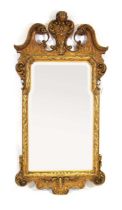 A late 19th century American giltwood and plaster wall mirror by Berkey and Gay Furniture Company (