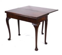 A 19th century mahogany games-cum-tea table with a hidden drawer, probably Irish, the rear leg