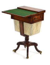 A 19th century mahogany and ebony line strung work table, presumably Irish, the folding leaves