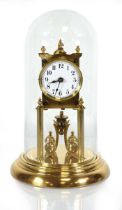 An early 20th century 400-day mantle clock in a brass case, under a glass dome, overall h. 32 cm