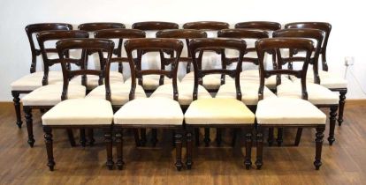A set of fifteen 19th century mahogany and upholstered dining chairs on turned front legs Castors
