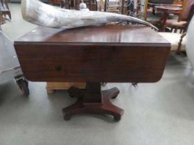 A 19th century mahogany drop-leaf table with a single drawer, rectangular column, platform base