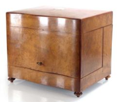 A 19th century French tantalus or 'cave a liqueur' cabinet in walnut, the rosewood interior with