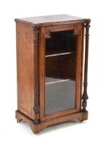 A late Victorian figured walnut and marquetry music cabinet, the glazed door enclosing two shelves