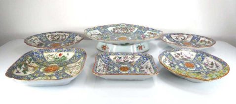 A 19th century Chinese Export serving dish of oval form, allover decorated with birds on