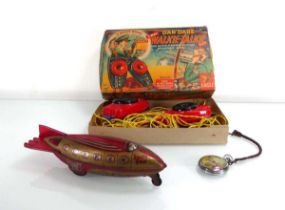 A Dan Dare pocket watch, a Dan Dare Walkie-Talkie set, boxed and a tinplate space ship (3)
