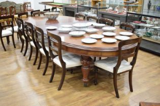 A Victorian mahogany extending dining table with three fitted leaves, on turned legs with castors,