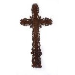 A 19th century French cast iron cross or crucifix relief decorated with ivy leaves, flowers and a