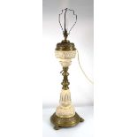 A Victorian brass mounted and earthenware adjustable lamp Damaged to the central resevoir