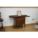 A George III gentleman's mahogany campaign-style washstand, the top opening to reveal a mirror and
