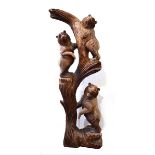 A mid-20th century Black Forest style carving modelled as three bears climbing a branch, h. 155 cm