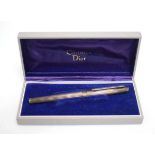A Christian Dior silver fountain pen with a 14ct gold nib, boxed