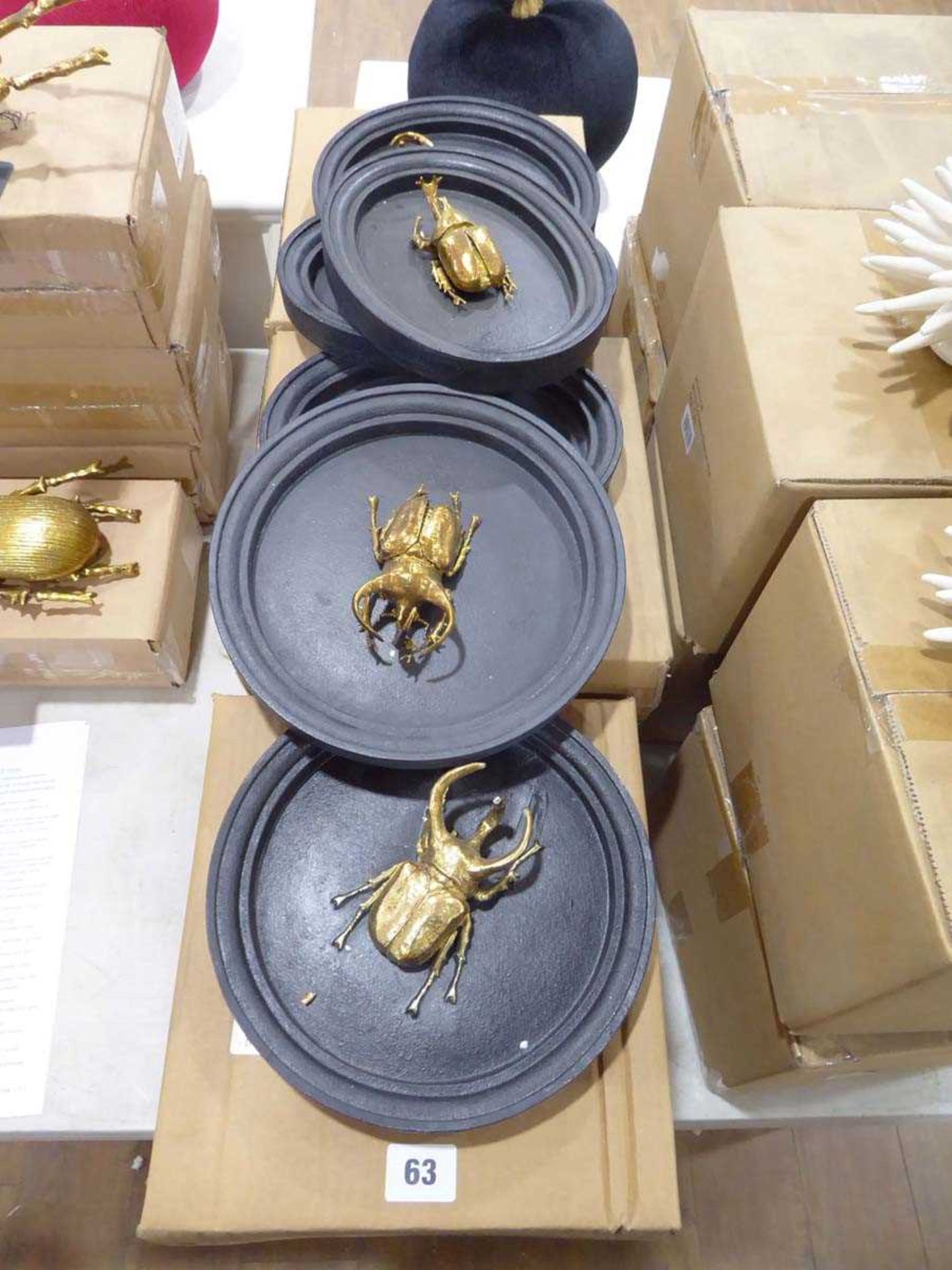 +VAT 9 boxes of various gilt beetle wall plaques