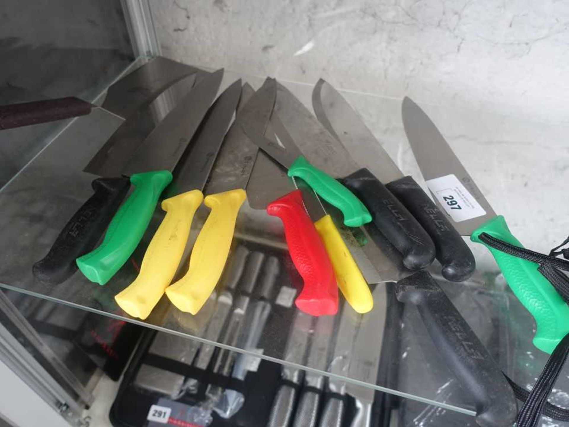 +VAT Half shelf of various chefs knives with colour coded handles