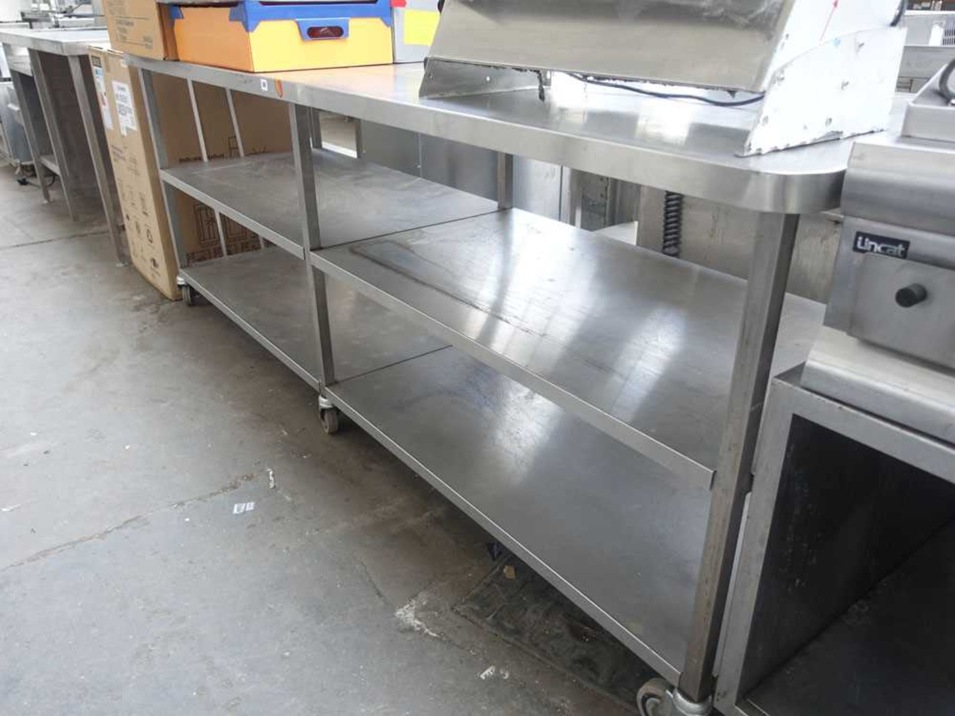 240cm stainless steel preparation table on castors with shelves under - Image 2 of 2