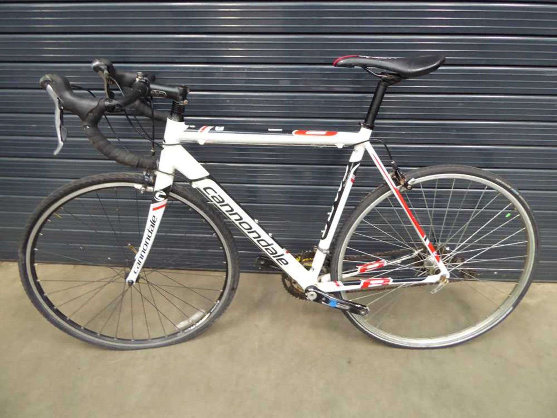 Cannondale white black and red gents racing bike