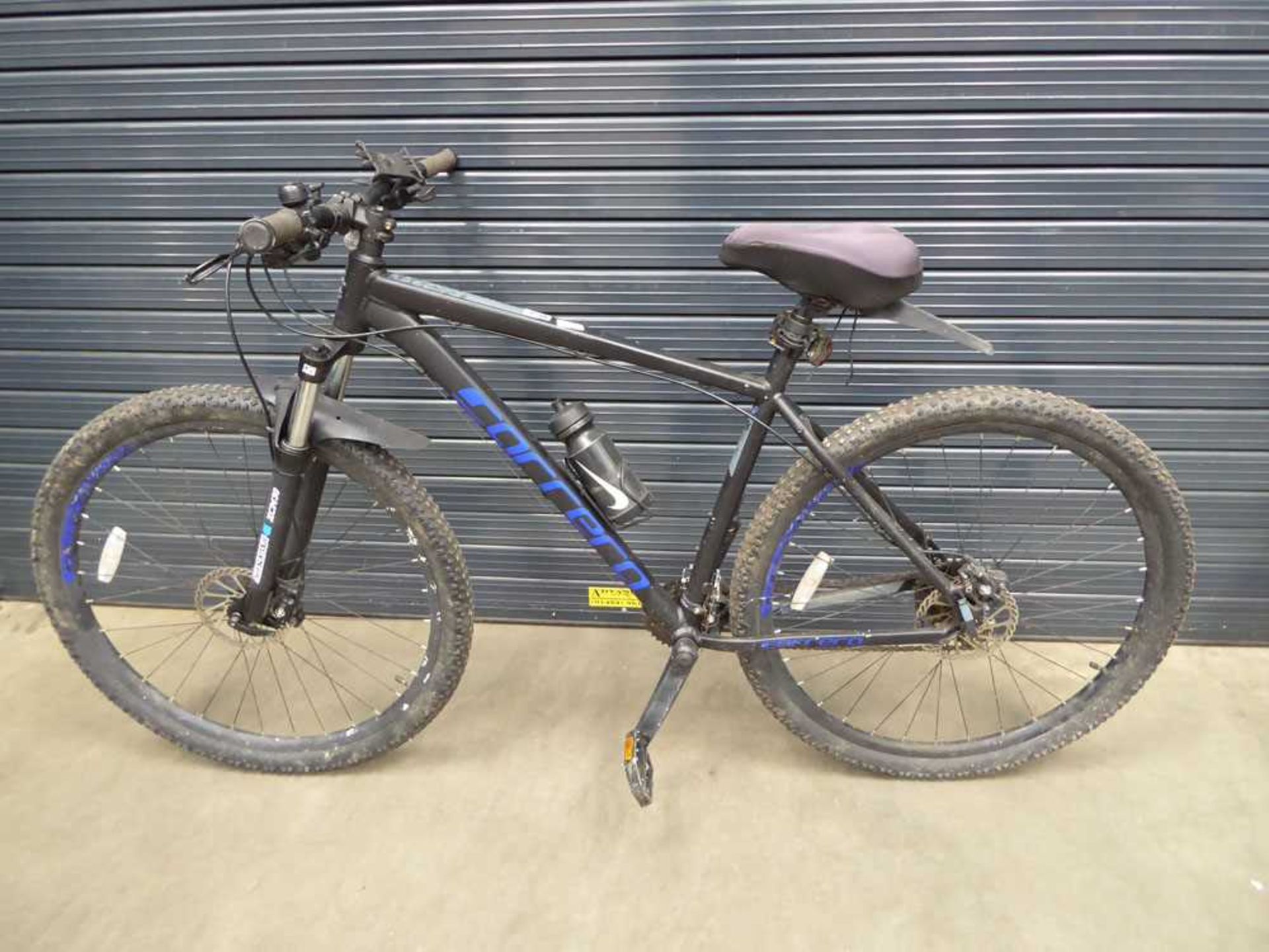 Black and blue Carrera Hellcat gents mountain bike