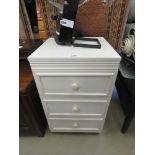 White painted three drawer bedside cabinet
