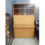 Teak fall front bureau with glazed bookcase over and cupboard under