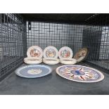 Cage containing a quantity of Wedgwood childrens story plates and commemorative ware