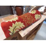 Gold and red floral carpet runner
