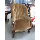 Carved Victorian button back armchair