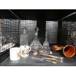 Cage containing decanters, loose cutlery, bugle and commemorative mugs