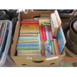 Box containing childrens novels and annuals