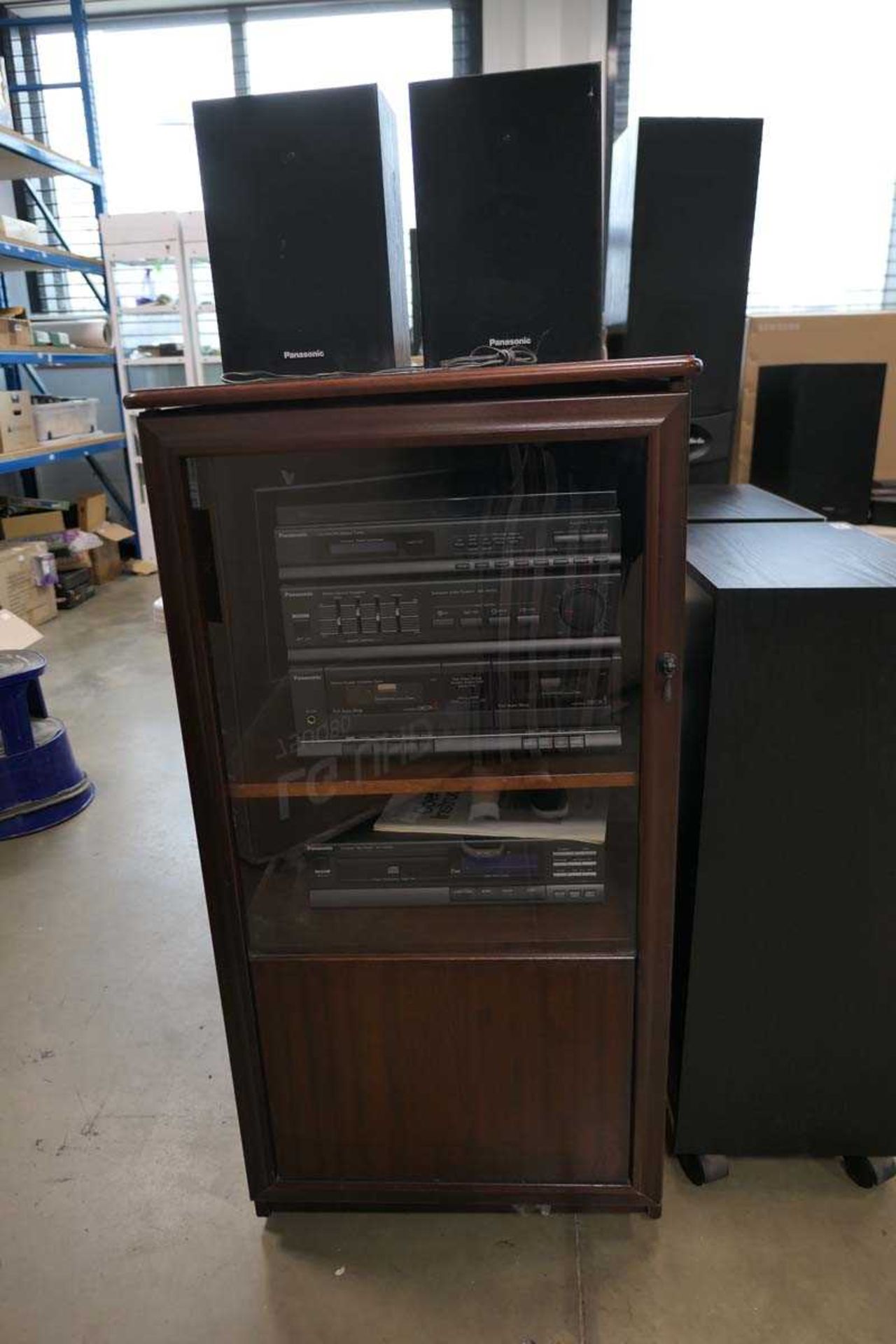 Mahogany hifi cabinet containing Panasonic hifi with speakers and albums