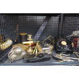Cage containing a vintage telephone, early mobile phone, candlestick, combs and dishes