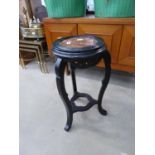 A chinoiserie ebonised plant stand with a marble insert