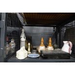 Cage containing Japanese gourd vases, carved stone elephant, Nao style figure, wooden box and