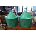 Pair of demijohns with plastic carry cases