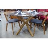 +VAT Circular dining table plus four upholstered chairs