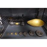 Cage containing kitchen scales and weights