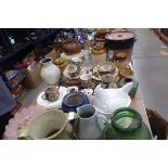 Large quantity of meat platters, crocks, water jugs, vases, sauce bottles and various teapots