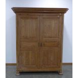 A late 19th/early 20th century stripped-pine double door 'knock-down' wardrobe