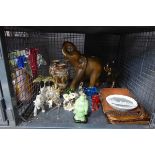 Cage containing leather bags, ornamental elephants, Japanese vases and glass ornaments