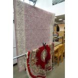 Pink floral carpet plus a circular Chinese mat