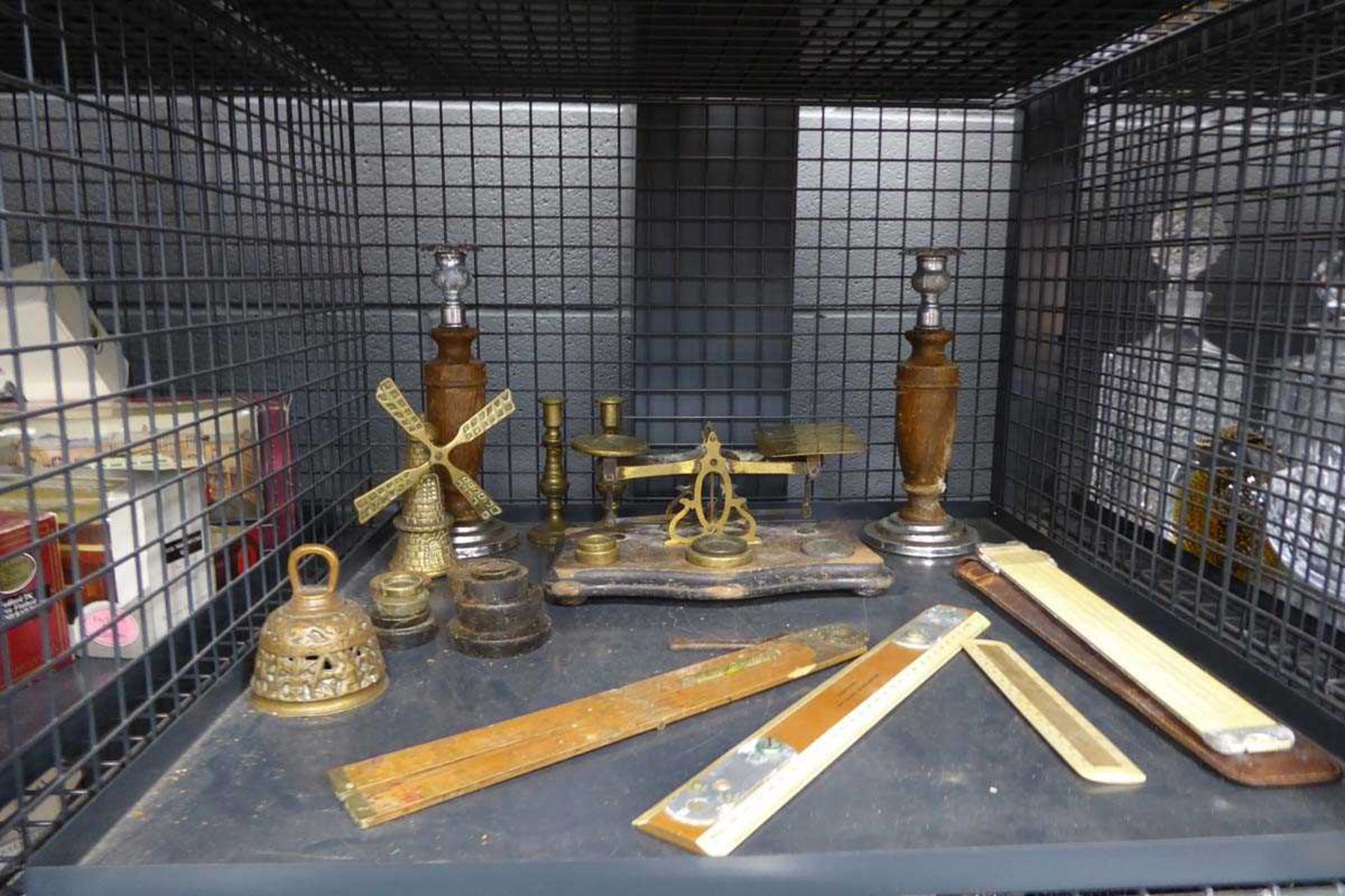 Cage containing postal scales, rulers, weights and candlesticks