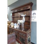 Oak dresser with carved panels