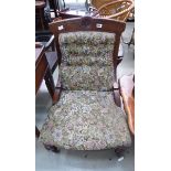 Floral upholstered library chair with carved frame